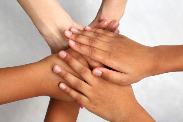 istock hand different people stacked on top of each other 905049190