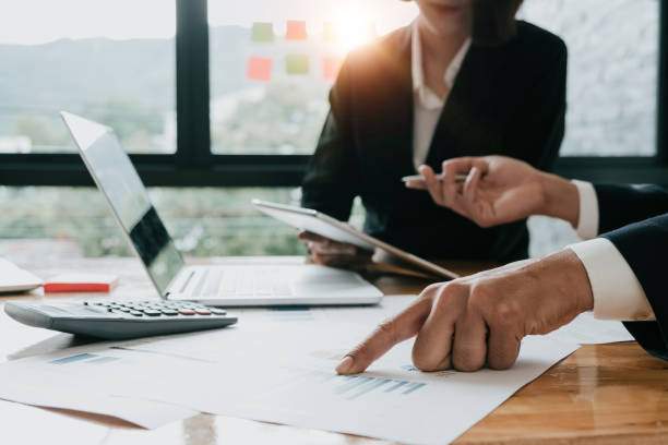 istock Business team analyzing income charts and graphs with modern laptop computer. Business analysis and strategy concept. 905049300