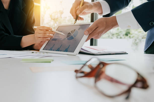 istock Business team meeting to discuss statistical data presented in the form of digital graphs and charts 905049320