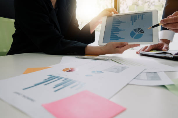 istock Business team meeting to discuss statistical data presented in the form of digital graphs and charts 905049322