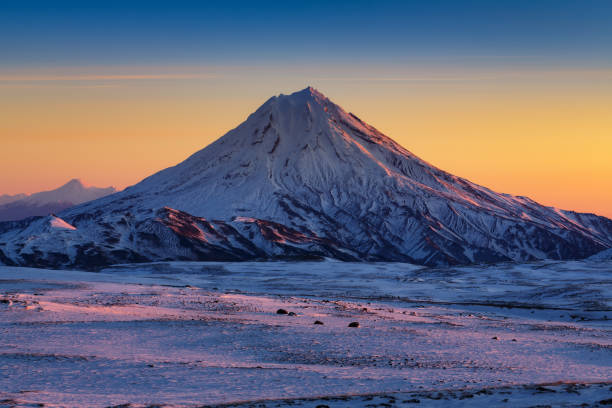 Stunning winter mountain landscape of Kamchatka Peninsula at sunrise stock photo