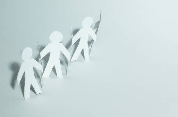 istock business background.three paper man paper background 905068546