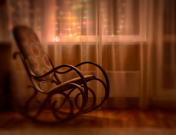 istock A rocking chair by the window 905072276