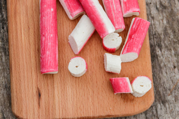 istock Crab sticks on cutting board on rustic wooden table 905075284