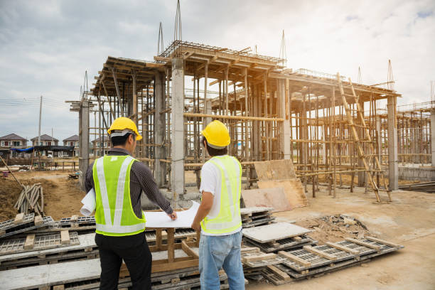istock Asian business man construction engineer workers at house building site 905076460