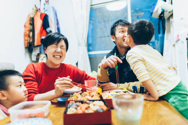 istock Family Enjoying Eating Together 905082820