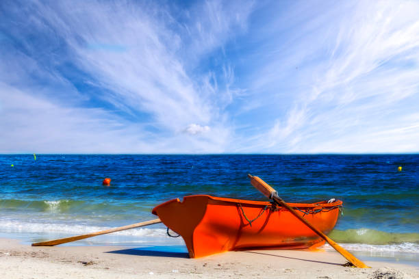 rettungsschwimmer rescue boot am strand - lifeguard orange nature beach stock-fotos und bilder