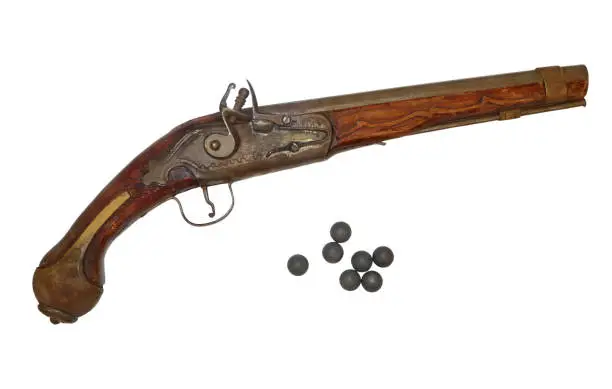 Antique gun eighteenth-nineteenth centuries and lead bullets for him in isolation.