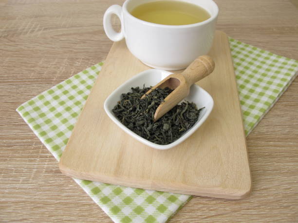 istock Cup of chun mee green tea from china 905094022