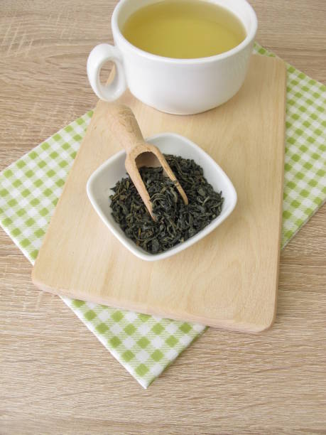 istock Cup of chun mee green tea from china 905094034