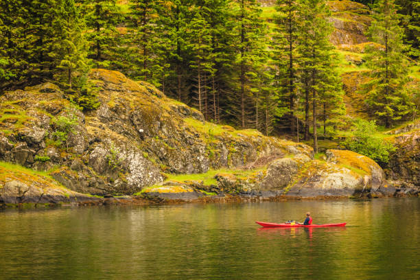 istock fjord in Norway and people kayaking 905098646