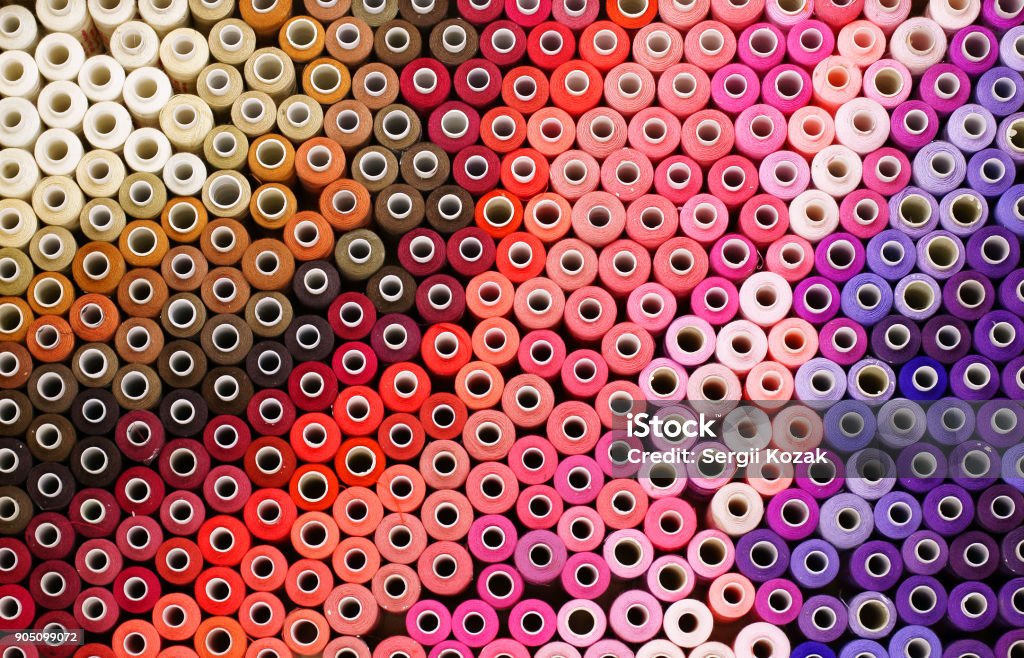 Colored threads in a reel Colored threads in a reel background bobbin clothing color colorful cotton Textile Stock Photo