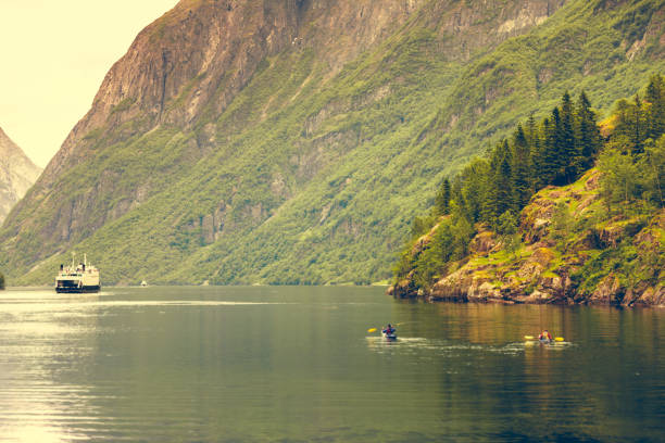 istock fjord in Norway and people kayaking 905099182