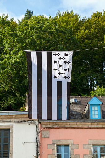 The flag of Brittany is called the Gwenn-ha-du, which means white and black in Breton. It is also unofficially used in the département of Loire-Atlantique although this now belongs to the Pays de la Loire and not to the région of Brittany, as the territory of Loire-Atlantique is historically part of the province of Brittany.