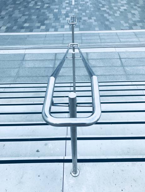 Aluminum handrail of staircase close up outdoor stock photo