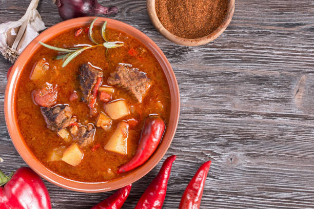 Hungarian goulash top Goulash on rustic wooden  background. Traditional hungarian meal,  beef stew. Copy space hungarian culture stock pictures, royalty-free photos & images