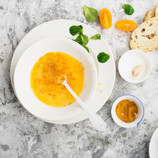 istock Ingredients for cooking scrambled eggs or omelets with green herbs, fresh vegetables, broccoli and turmeric as a healthy breakfast or lunch option. View from above. Against a light background 905102150