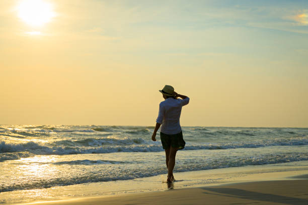 istock Happy woman on beach 905102168