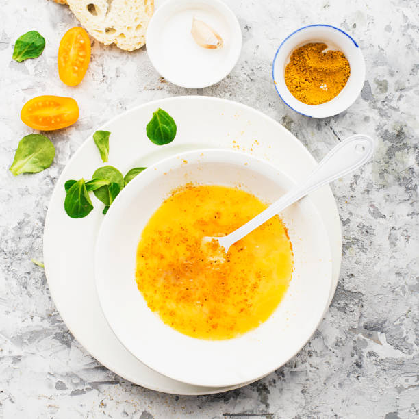 istock Ingredients for cooking scrambled eggs or omelets with green herbs, fresh vegetables, broccoli and turmeric as a healthy breakfast or lunch option. View from above. Against a light background 905102252