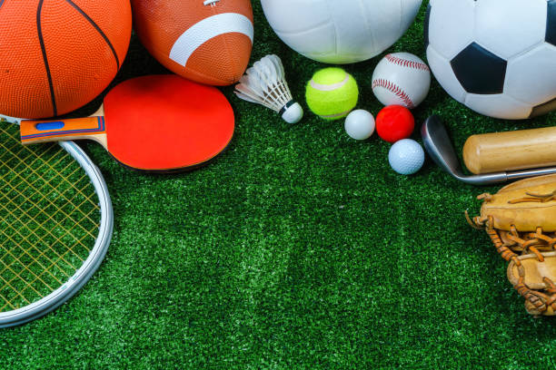 istock Sports Equipment on green grass, Top view 905105152