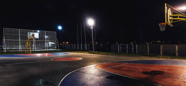 istock Basketball Court at Night 905105230