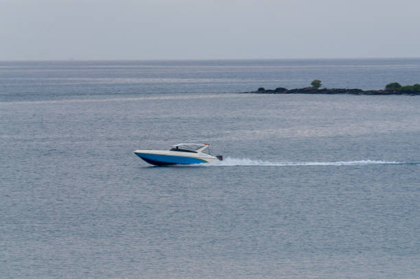 istock Speed Boat drive throught the calm sea 905107032