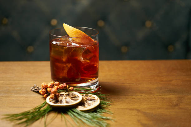 istock Glass of whiskey with ice cubes and lime 905118606