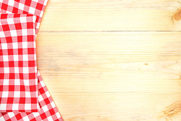 istock Tablecloth over colorful wooden table. 905118792
