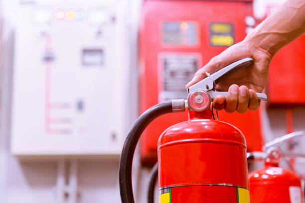 istock Close up Fire extinguisher and pulling pin on red tank. 905118858
