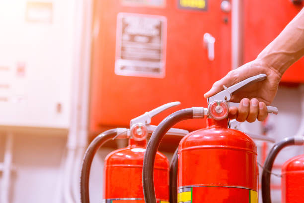 istock Close up Fire extinguisher and pulling pin on red tank. 905118860