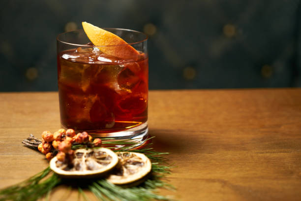 istock Glass of whiskey with ice cubes and lime 905118878