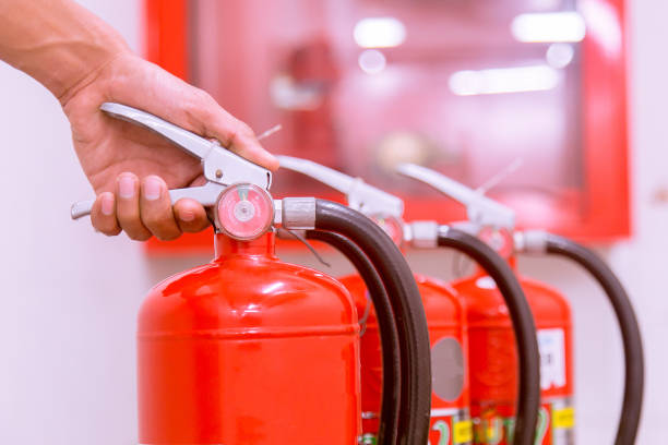 istock Close up Fire extinguisher and pulling pin on red tank. 905118998