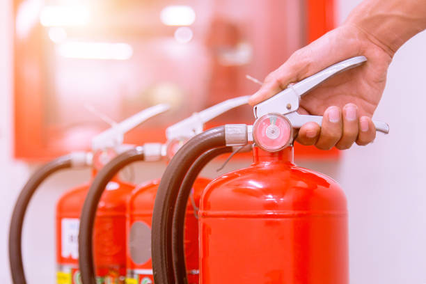 istock Close up Fire extinguisher and pulling pin on red tank. 905119000