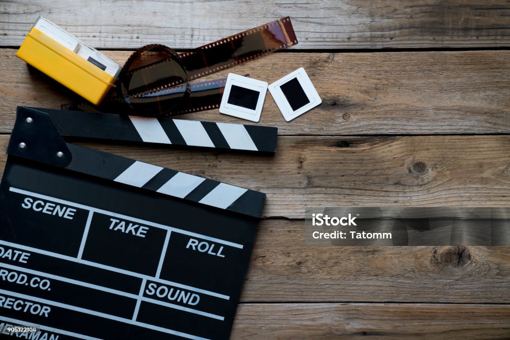 movie clapper on wood table ; film, cinema and vedio photography concept movie clapper on wood table ; film, cinema and video photography concept Action Movie Stock Photo