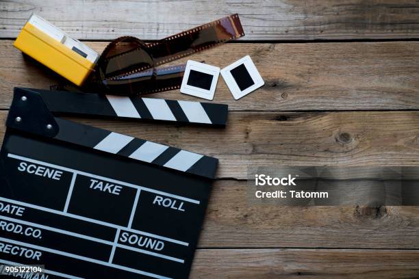 Movie Clapper On Wood Table Film Cinema And Vedio Photography Concept Stock Photo - Download Image Now