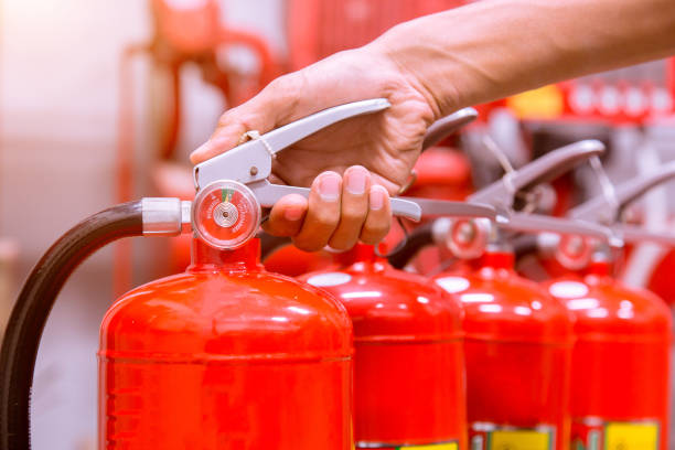 istock Close up Fire extinguisher and pulling pin on red tank. 905126168