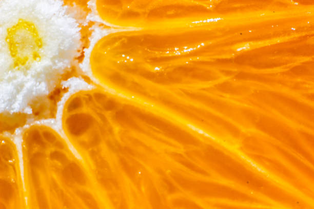 istock a slice of orange very close up - macro 905126306