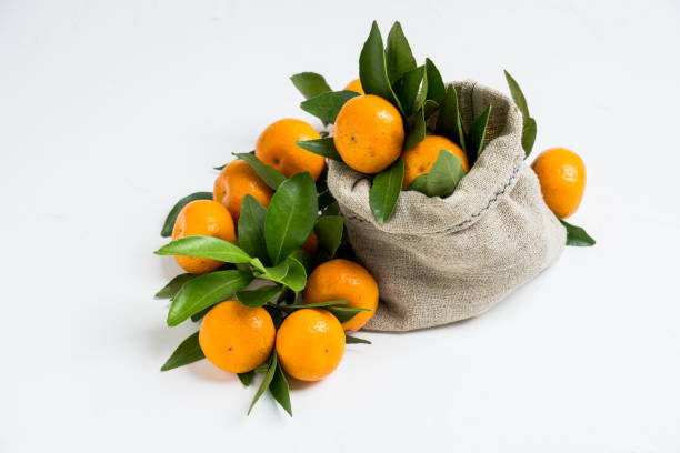 istock Fresh ripe mandarines on the rustic wooden background 905130808