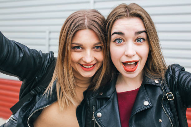istock Two young girls taking selfie using smartphone 905131080