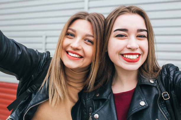 istock Two young girls taking selfie using smartphone 905131436