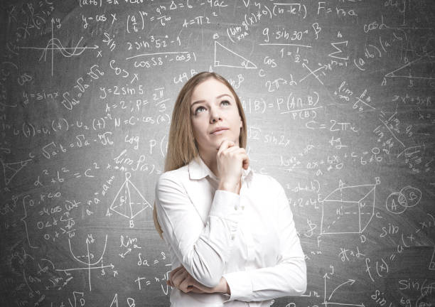 istock Dreamy blonde businesswoman, formulas 905137984