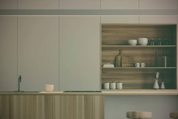 istock White kitchen, wooden bar stand close up toned 905138594