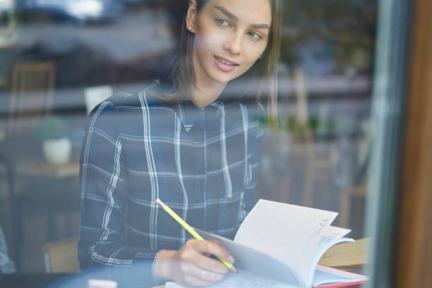 istock Thoughtful attractive female student spending time in cafe interior while creating report for homework, professional administrative manager pondering on working schedule organizing job process 905138912