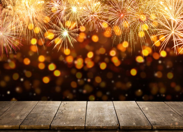 istock Celebration background with fireworks explosions and empty wooden planks 905139526