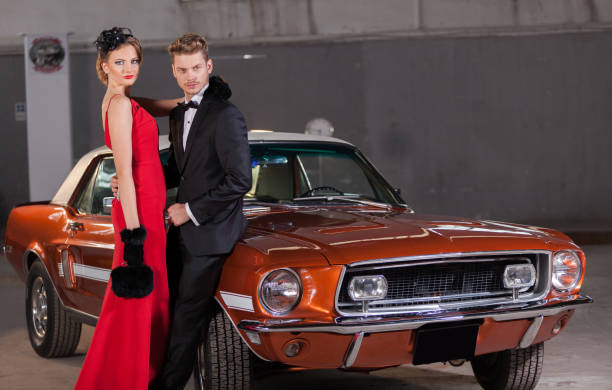 istock Young elegance couple at the garage with her retro car 905143018