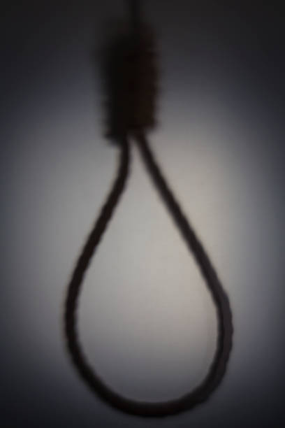 Shadow blur of hanging rope noose Shadow blur of hanging rope noose, concept of justice silhouette of the hanging noose stock pictures, royalty-free photos & images