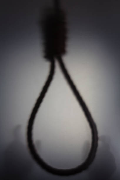 Shadow blur of man hand holding hanging rope noose Shadow blur of man hand holding hanging rope noose, concept of justice silhouette of the hanging noose stock pictures, royalty-free photos & images