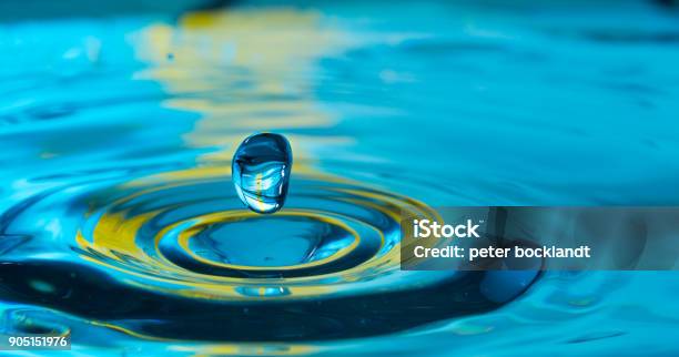 Water Drop In A Glass Of Water Stock Photo - Download Image Now - Water, Impact, Drop