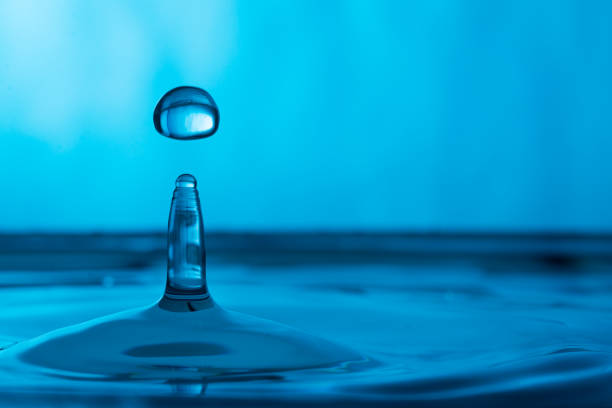 istock water drop in a glass of water 905151978