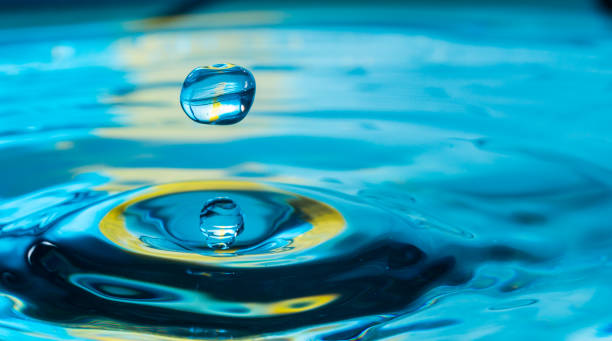 istock water drop in a glass of water 905151982